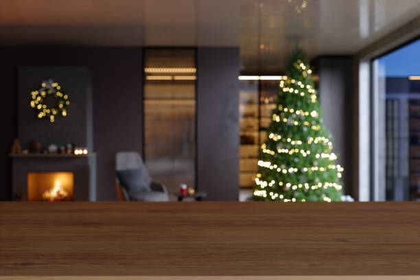 istock Empty Wooden Table Top With Blurred Christmas Tree, Armchair And Fireplace Background 1342187599