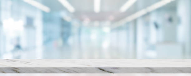 istock Marble stone table top with blurry image of Mall complex in background. 1342191756