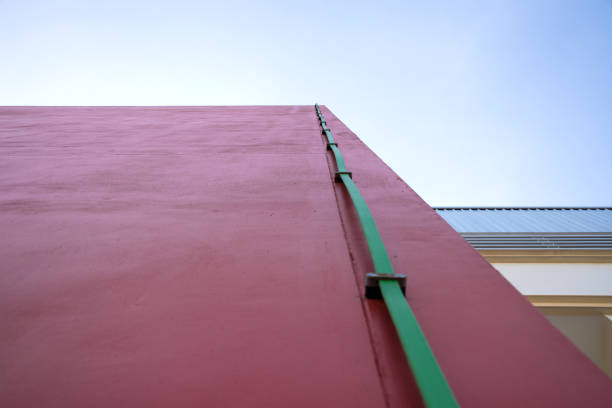 Ground cable from lightning rod on the wall.