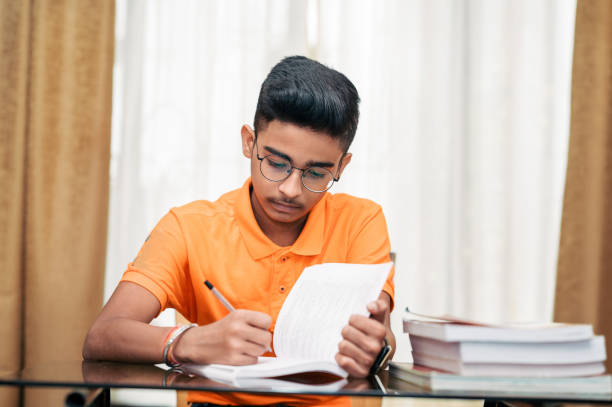 istock Young boy preparing for exam, Studying at home. 1342191936