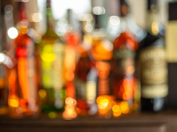 istock Beautiful bokeh from a row of alcoholic bottles in backlight. 1342192898