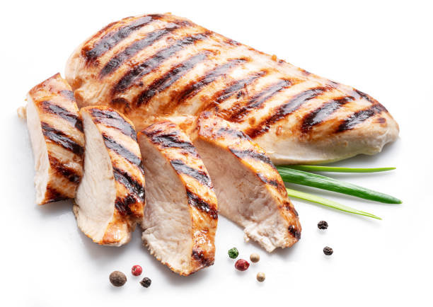 filetto di pollo alla griglia con erbe isolate su fondo bianco. - grilled chicken barbecue chicken vegetable foto e immagini stock
