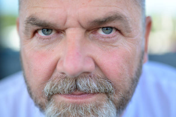 istock Senior bearded man staring intently into the lens 1342196882