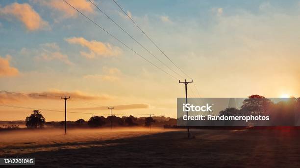 Power Line Sunrise Stock Photo - Download Image Now - Save The Planet, Carbon Neutrality, Electricity