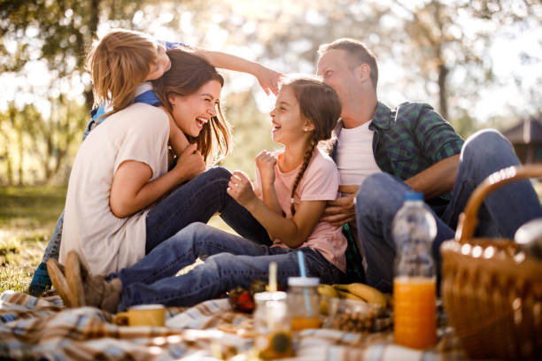 istock Cheerful family having fun on a picnic in spring day. 1342201314