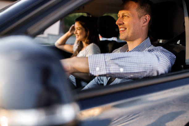 istock Happy man and his wife going on a trip by car. 1342201866