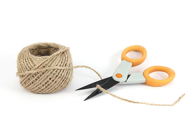 ball of string and scissors stock photo