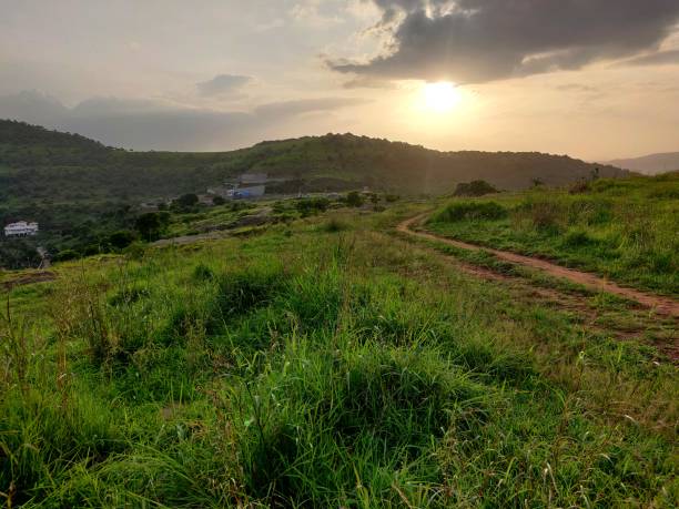 istock An old earthen road path running beyond the hills 1342203519
