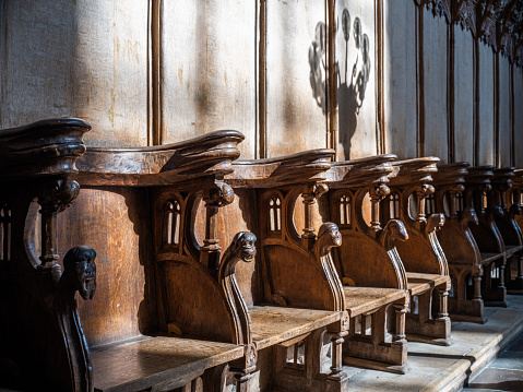 Wooden choir stalls in Roskilde Cathedral. \nRoskilde Cathedral was opened in 1175 when Denmark was still catholic. With the reformation in 1536 Denmark became protestant. Most Danish kings and queens are buried in the cathedral, which is on the UNESCO World Heritage list.