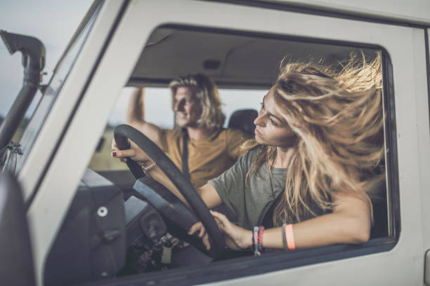 istock Young woman driving a car. 1342203597