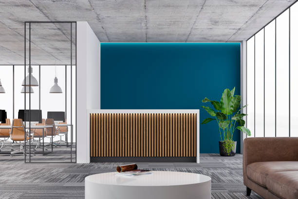 istock Large office interior: a reception desk, a lounge corner with copy space and wordesks behind glass door 1342204171