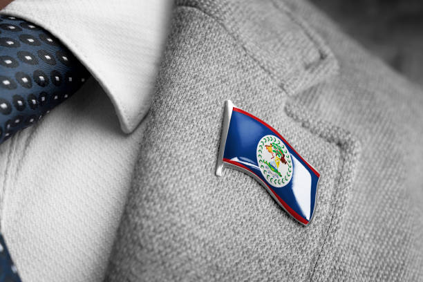 crachá de metal com a bandeira de belize em uma lapela de terno - flag of belize - fotografias e filmes do acervo