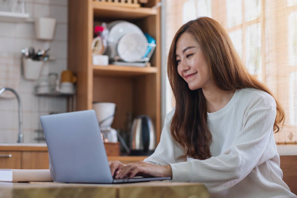 istock A young asian woman freelancer using laptop computer for working online at home 1342207871