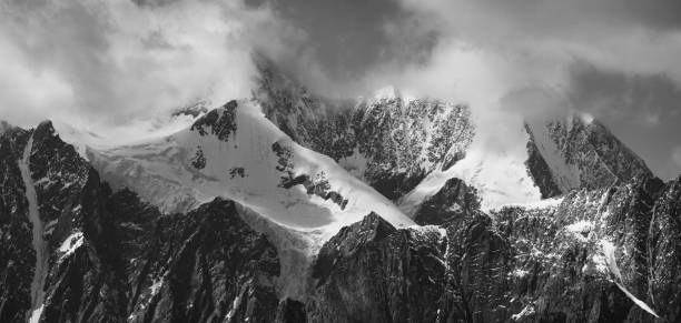 istock Black and white landscape. Snow-capped mountain peaks. 1342208232