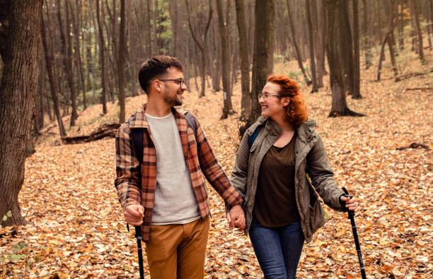 istock Young couple with backpack hiking in forest. 1342211284