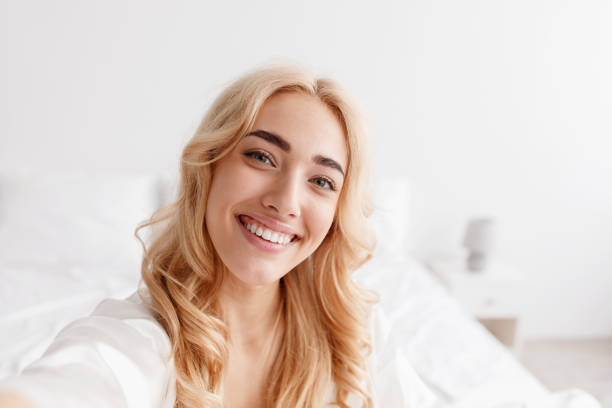 istock Positive emotions, blogger makes video stream at home on comfortable bed 1342212092
