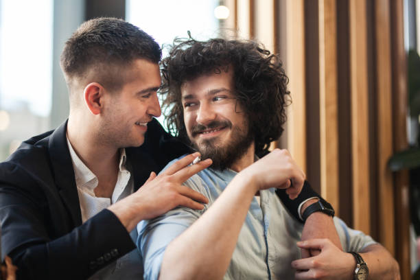 istock Two friends hugging in a cafe, smiling and having a cigarette. 1342216283