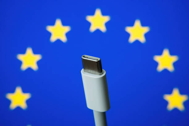 EUROPEAN UNION flag and USBC universal charging cable. Selective focus.