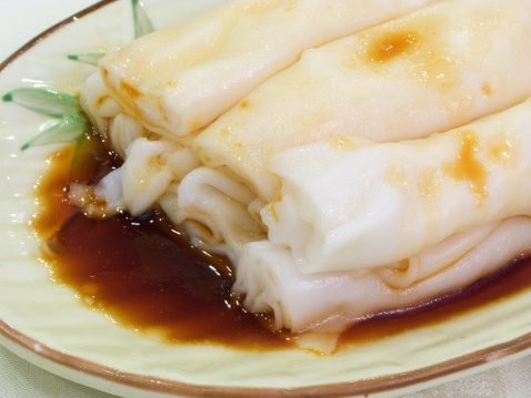 Plain rice sheet spring rolls with soy sauce. A popular breakfast and dim sum dish in China.