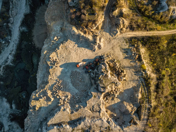 istock Stone Quarry Aerial. Heavy machinery working at stone qaurry. 1342218946