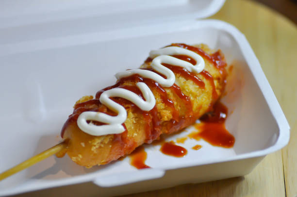 istock corn dog, pork sausage or sausage roll or breaded sausage 1342223717