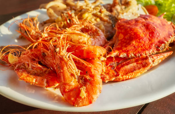 istock Grilled seafood platter with crab and prawns with garlic. 1342224723