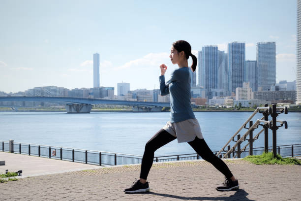 istock Woman stretching in office park 1342226205