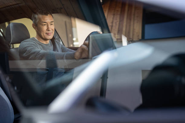 Man using global positioning system in car stock photo