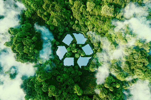 A lake in the shape of a recycling sign in the middle of untouched nature. An ecological metaphor for ecological waste management and a sustainable and economical lifestyle. 3d rendering.