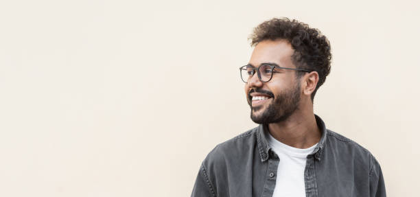 istock Handsome young man wearing glasses looking up 1342230554