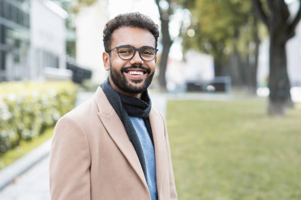 istock Handsome young man wearing warm clothing looking at camera 1342230568