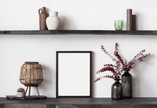 Artwork mock-up in interior design. Blank white picture frame on a white wall