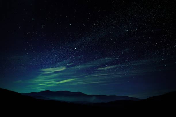 istock Mountain landscape and beautiful starry sky at night 1342233663