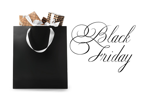 Shopping bag with gift boxes and text BLACK FRIDAY on white background