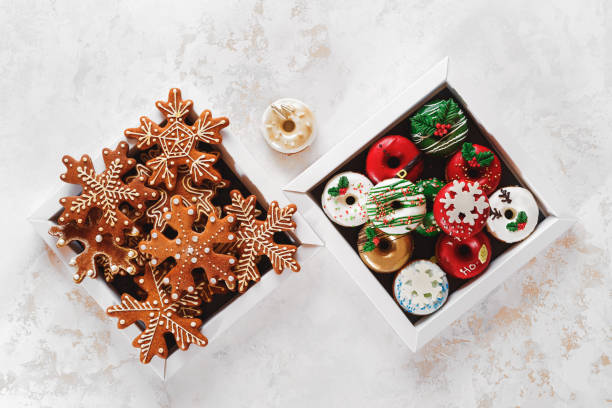 istock Christmas Cookie Boxes. Cardboard boxes with donuts and gingerbread as a gift. Top view, blank space 1342234634