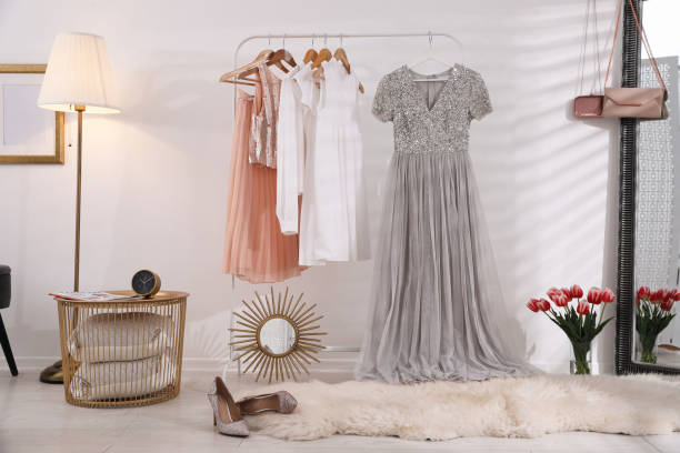 istock Rack with stylish women's clothes indoors. Interior design 1342234678