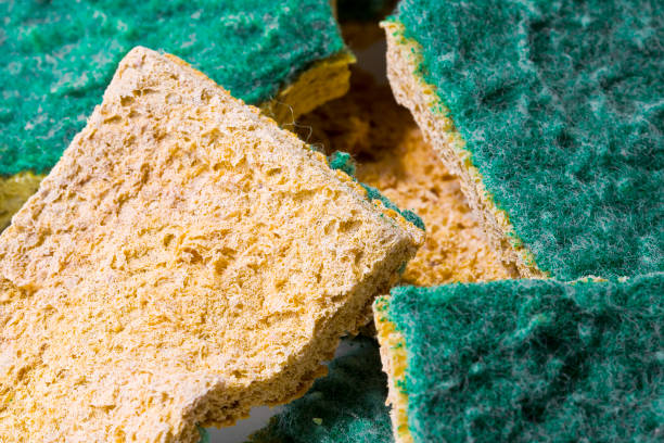 Old abrasive used sponges for household cleaning of kitchen: attention, they can hide dangerous bacteria stock photo
