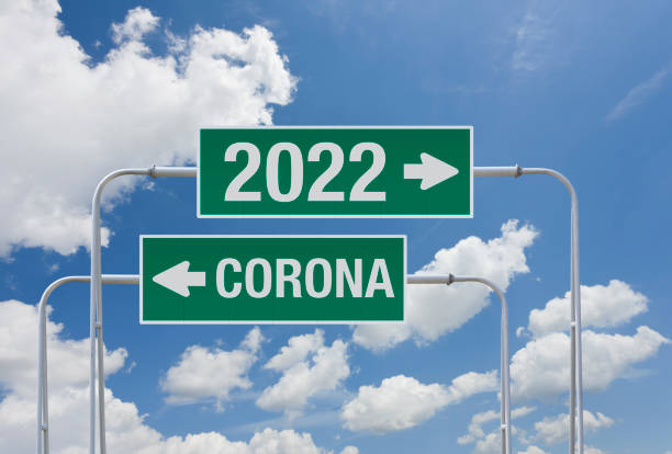 istock Covid-19 on road sign and year 2022 1342236259