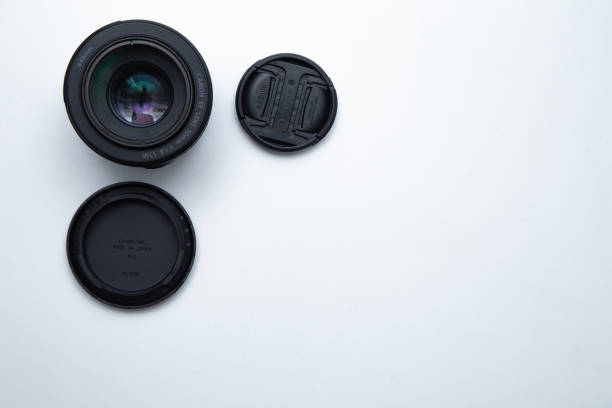 istock A small fixed lens for a professional camera on a white background with two covers 1342236625