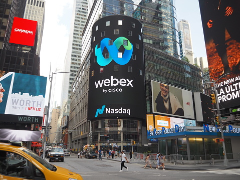 New York City, New York United States - August 29 2021: NASDAQ, National Association of Securities Dealers Automated Quotations and Cisco Webex corporate logo sign near Times Square.