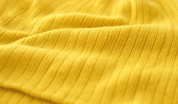 tricot doré comme fond abstrait, style de mode - jersey en matière textile photos et images de collection