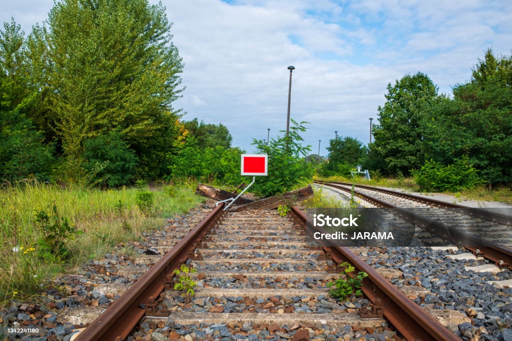 Barrier at the end of a railroad track. Dead End. The path that leads nowhere. Dead End Sign Stock Photo