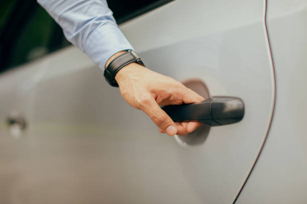 istock Man hand opening car back door, closeup photo 1342243739
