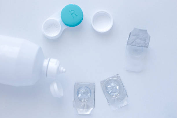 istock Lens remover, a container for storing lenses and two contact lenses lie 1342244483