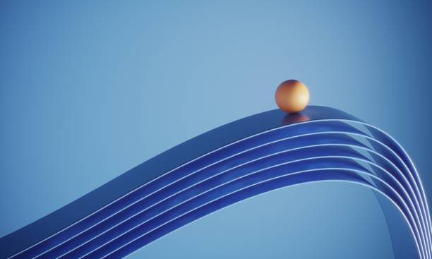Orange Colored Ball Standing On Top Of The Ribbons stock photo