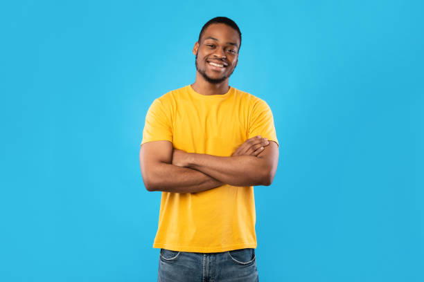 istock African American Guy Smiling To Camera Posing Over Blue Background 1342245501