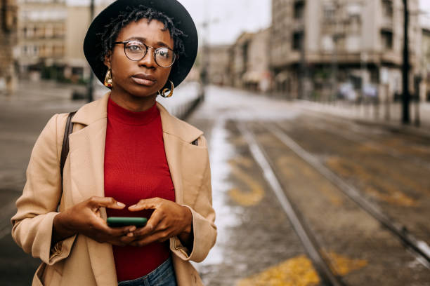 istock Young casually clothed woman waiting for the cab 1342247040