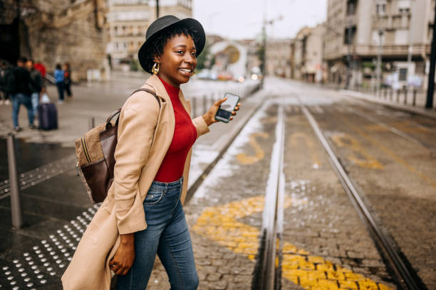 istock Young beautiful woman on bus station 1342247120