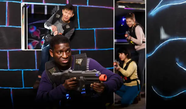 Photo of African American man playing lasertag