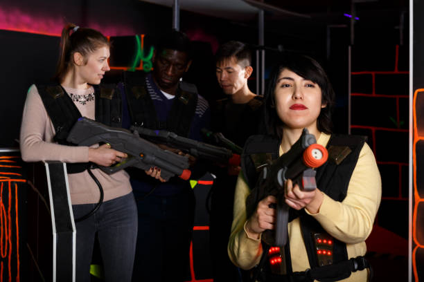 istock Latin woman lasertag player standing in full equipment before playing 1342247271